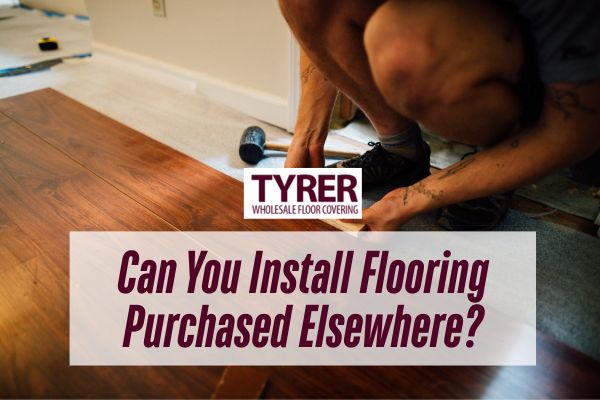 A person installs wood flooring, using tools on the ground, with the Tyrer Wholesale Floor Covering logo and the question “Can You Install Flooring Purchased Elsewhere” displayed over the image.
