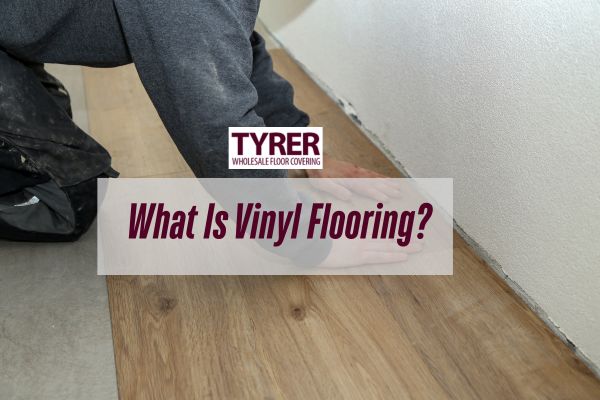 man installing a vinyl with a caption What Is Vinyl Flooring