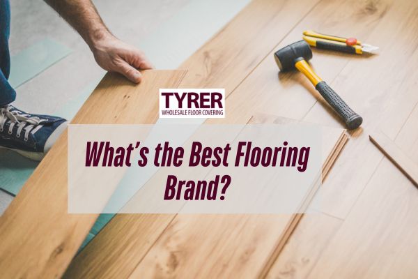 man installing a floor with a hammer beside with a caption What’s the Best Flooring Brand
